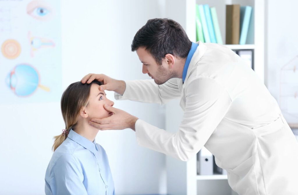 An eye doctor is examining a female patient's eye with dry eyes.