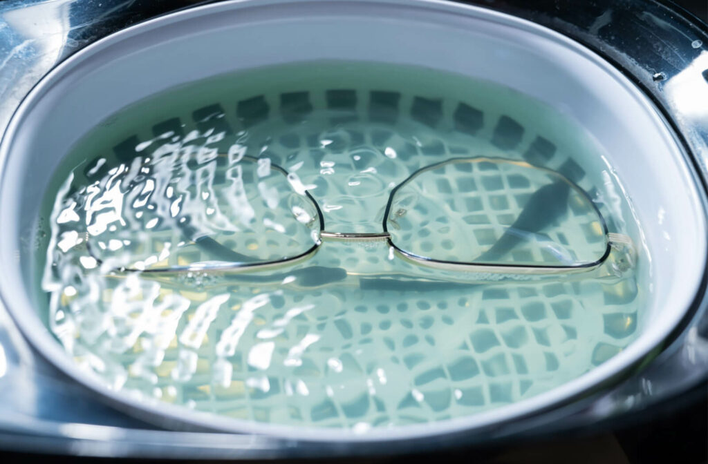 An eyeglass gets cleaned and soaked in lukewarm water.