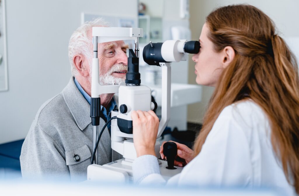 An older adult getting an eye exam to monitor their vision after cataract surgery