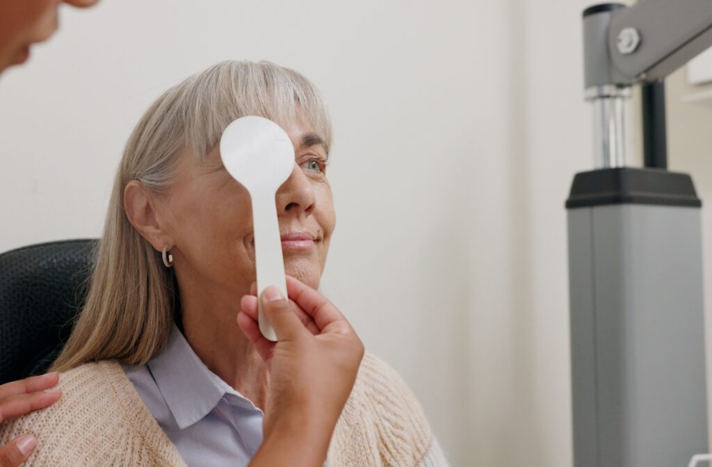 A woman having her eyes checked at the eye doctor after experiencing cloudy vision in one eye.